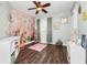Adorable bedroom with a whimsical wall mural, perfect for a room at 275 W 3Rd St, Chuluota, FL 32766