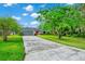 Beautiful single-story house featuring an extra long driveway, two-car garage, and manicured lawn at 275 W 3Rd St, Chuluota, FL 32766