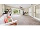Inviting living room filled with natural light featuring a sofa, desk, and built-in shelving for added storage at 275 W 3Rd St, Chuluota, FL 32766