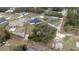 A serene aerial view showcasing the home's placement within a tranquil wooded neighborhood at 2824 Sw 166Th Ln, Ocala, FL 34473
