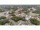 Aerial view of a tranquil neighborhood featuring a mix of homes and lush green trees at 2824 Sw 166Th Ln, Ocala, FL 34473