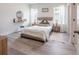 Calming bedroom with natural light, decorative mirror, and neutral tones at 2824 Sw 166Th Ln, Ocala, FL 34473