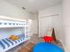 Bright bedroom featuring a bunk bed, playroom, and storage at 2824 Sw 166Th Ln, Ocala, FL 34473