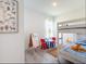 Charming bedroom featuring a bunk bed, playroom area, and playful decor at 2824 Sw 166Th Ln, Ocala, FL 34473