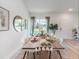 Cozy dining room featuring modern accents, neutral colors, and backyard view at 2824 Sw 166Th Ln, Ocala, FL 34473