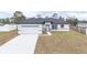 Charming single-story home with a well-manicured lawn, attached garage, and inviting front entrance at 2824 Sw 166Th Ln, Ocala, FL 34473