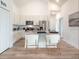 Contemporary kitchen featuring an island with seating, stainless steel appliances, and a pantry at 2824 Sw 166Th Ln, Ocala, FL 34473