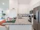 Stylish kitchen with granite countertops, stainless steel appliances, and a large island at 2824 Sw 166Th Ln, Ocala, FL 34473