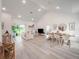 Bright, open-concept living room with soaring ceilings, modern lighting, and luxury vinyl plank flooring at 2824 Sw 166Th Ln, Ocala, FL 34473