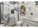 Stylish bathroom with black framed shower, a unique vessel sink, and modern decor accents at 2905 Tupelo Loop, St Cloud, FL 34772