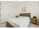 Clean bedroom featuring a comfortable bed, and modern tile flooring at 2905 Tupelo Loop, St Cloud, FL 34772