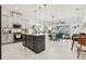 Open kitchen with island seating flows seamlessly into the dining and living area at 2905 Tupelo Loop, St Cloud, FL 34772