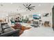 Spacious living area with modern furnishings and a seamless transition to the open kitchen at 2905 Tupelo Loop, St Cloud, FL 34772