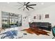 Bright living room with sliding glass doors, contemporary furniture, and an open floor plan at 2905 Tupelo Loop, St Cloud, FL 34772