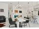 Open living space featuring a dining area, modern lighting, and an open view of the kitchen at 2905 Tupelo Loop, St Cloud, FL 34772