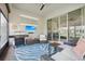 Inviting screened patio with comfortable seating, a grill, and a mounted TV at 2905 Tupelo Loop, St Cloud, FL 34772