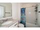 Bathroom with a vanity, sink, toilet and bathtub with vibrant curtain at 2936 Sunridge Loop, St Cloud, FL 34771