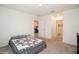 Bedroom with carpet, quilt on the bed, and doorways to other rooms at 2936 Sunridge Loop, St Cloud, FL 34771