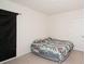Carpeted bedroom with an air mattress, and a window with black curtains at 2936 Sunridge Loop, St Cloud, FL 34771