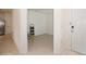 Open entryway featuring neutral tile floors, a white front door, and a view into the kitchen at 2936 Sunridge Loop, St Cloud, FL 34771