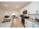 Stylish kitchen featuring granite counters, a breakfast bar, and stainless steel appliances at 2936 Sunridge Loop, St Cloud, FL 34771