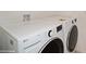 Modern laundry room featuring a white, front-load LG washer and dryer set at 2936 Sunridge Loop, St Cloud, FL 34771