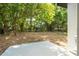 Wide backyard view featuring large trees and green foliage at 3042 Herold Dr, Orlando, FL 32805