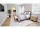 Spacious bedroom with wood flooring and a large window and accent rug at 3042 Herold Dr, Orlando, FL 32805