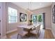 Elegant dining room with contemporary lighting, stylish artwork, and large windows for natural light at 3042 Herold Dr, Orlando, FL 32805