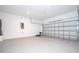 Spacious two car garage with high ceilings and white painted block walls at 3042 Herold Dr, Orlando, FL 32805