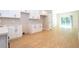 Spacious kitchen with white cabinetry, sleek hardware, and a view of the backyard through sliding glass doors at 3042 Herold Dr, Orlando, FL 32805