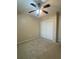 This bedroom features neutral walls, carpet and a ceiling fan with integrated lighting at 322 E Central Blvd # 908, Orlando, FL 32801