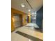 Hallway with stainless steel elevators and modern lighting at 322 E Central Blvd # 908, Orlando, FL 32801