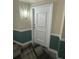 A foyer area showcases a white front door with decorative trim and wall sconce lighting at 322 E Central Blvd # 908, Orlando, FL 32801