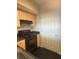 A kitchen has a black stove and light wood cabinets providing efficient storage at 322 E Central Blvd # 908, Orlando, FL 32801