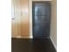 A kitchen features black appliances and light wood cabinets for ample storage space at 322 E Central Blvd # 908, Orlando, FL 32801