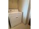 A laundry room featuring a white dryer and wire shelving for storage at 322 E Central Blvd # 908, Orlando, FL 32801