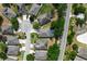 Scenic aerial view of a residential neighborhood featuring well-maintained homes and landscaping in a cul-de-sac setting at 3281 Saloman Ln, Clermont, FL 34711