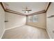 Spacious bedroom with tray ceilings, tile flooring, two windows, and neutral walls at 3281 Saloman Ln, Clermont, FL 34711