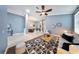 Spacious open-concept living room with hardwood floors flowing to dining area, offering a modern design at 3281 Saloman Ln, Clermont, FL 34711