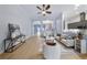 Bright and airy living room with modern furniture, neutral tones, and an open concept design at 3281 Saloman Ln, Clermont, FL 34711
