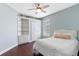 Comfortable bedroom features a built-in bookshelf and a ceiling fan at 3317 Oakmont Ter, Longwood, FL 32779