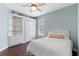 Comfortable bedroom features a built-in bookshelf and a ceiling fan at 3317 Oakmont Ter, Longwood, FL 32779