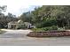 Inviting community entrance surrounded by well-maintained gardens and landscaping at 3317 Oakmont Ter, Longwood, FL 32779