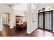 Formal dining room features hardwood floors, a decorative light fixture, and an exquisite China cabinet at 3317 Oakmont Ter, Longwood, FL 32779