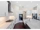 Modern kitchen with white cabinets, stainless steel appliances, and a farmhouse sink at 3317 Oakmont Ter, Longwood, FL 32779
