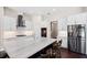 Bright kitchen featuring white cabinets, black hardware, subway tile backsplash, and a center island at 3317 Oakmont Ter, Longwood, FL 32779