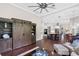Open-concept living room flowing into kitchen and dining areas with hardwood floors at 3317 Oakmont Ter, Longwood, FL 32779