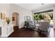 Elegant living room boasts natural light, comfortable seating, and seamless indoor-outdoor flow to the backyard at 3317 Oakmont Ter, Longwood, FL 32779