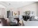 Open-concept living room with a cozy seating arrangement and clear views of the entrance and other living spaces at 3317 Oakmont Ter, Longwood, FL 32779